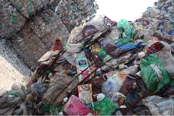A load of imported material heavily contaminated with plastic film, believed to have originated in the US due to the contents of the bale which includes Minute Maid drinks cartons and A&W Root Beer bottles